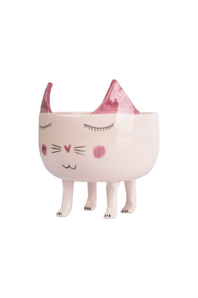 pot with a smiling cat figure. cat's ears are in pink colour.