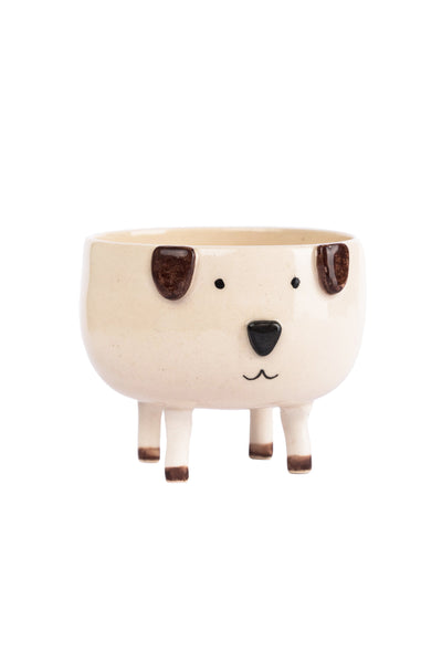 dog figured pot with brown coloured ears, four legs, one black nose and one mouth