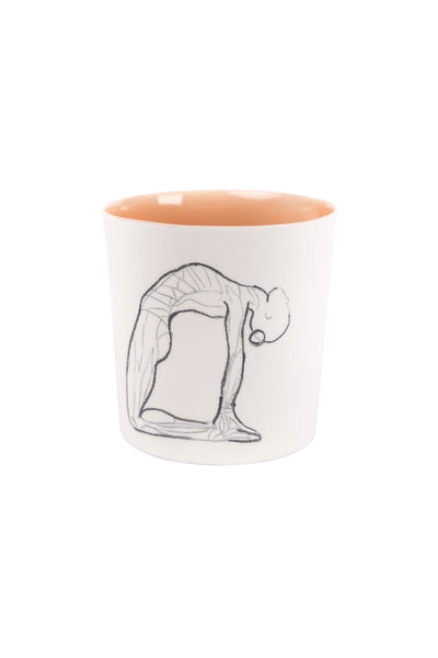 white coloured outside, orange coloured inside Camel yoga pose drawn mug