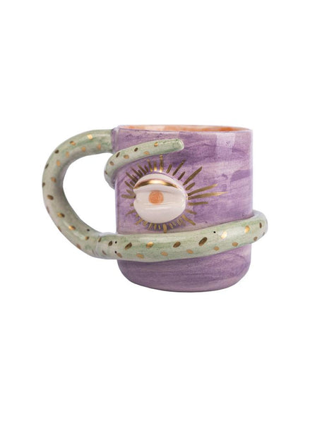 purple colour mug. there is an eye on it and its holder snake figure and wrapping around the cup