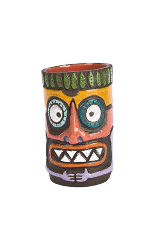 colourful tiki beer mug. tiki face has two big circle eyes, triangle shaped seven teeth, big orange coloured nose