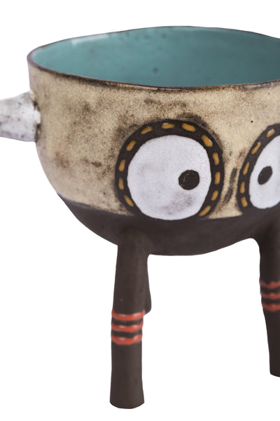  figure with two big eyes, two horns and three feet pot bowl